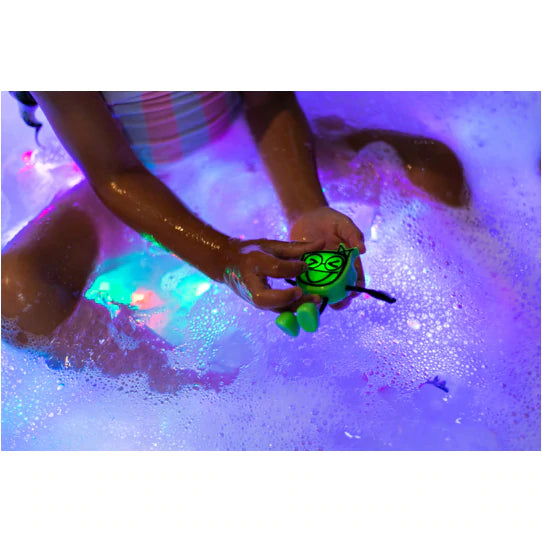 Green Pippa Glo Pal glowing in Bath Tub
